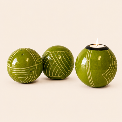 Carved and coloured Monkey Balls and Tlite in a lime set on a light beige coloured background