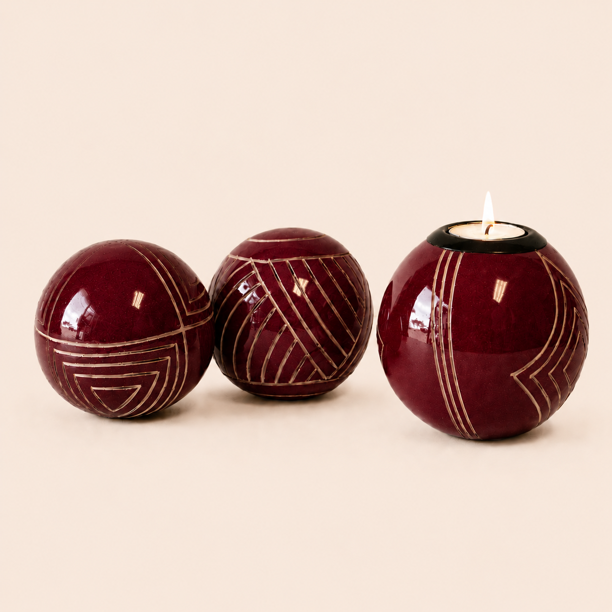 Carved and coloured Monkey Balls and Tlite in burgundy and set on a beige background