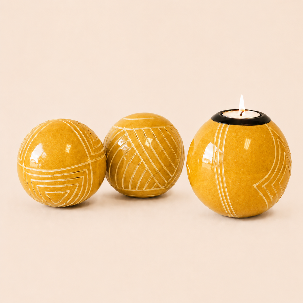 Carved and coloured Monkey Balls and Tlite in yellow and set on a beige background
