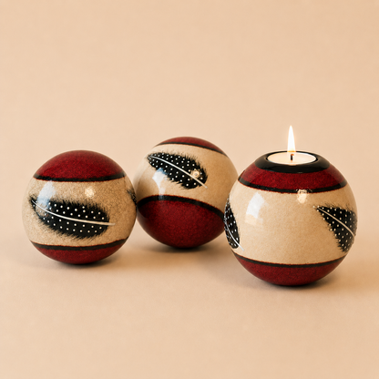 Coloured Feather Monkey Balls & Tlite in Red on a biege background