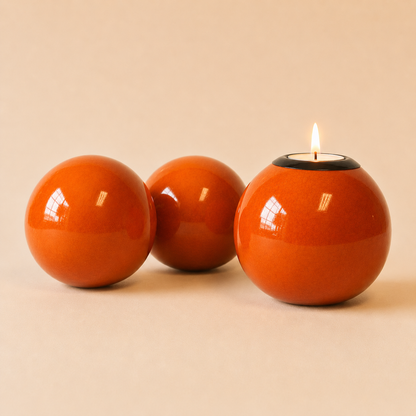 Coloured Monkey Ball and Tlite in Orange colour on a beige background