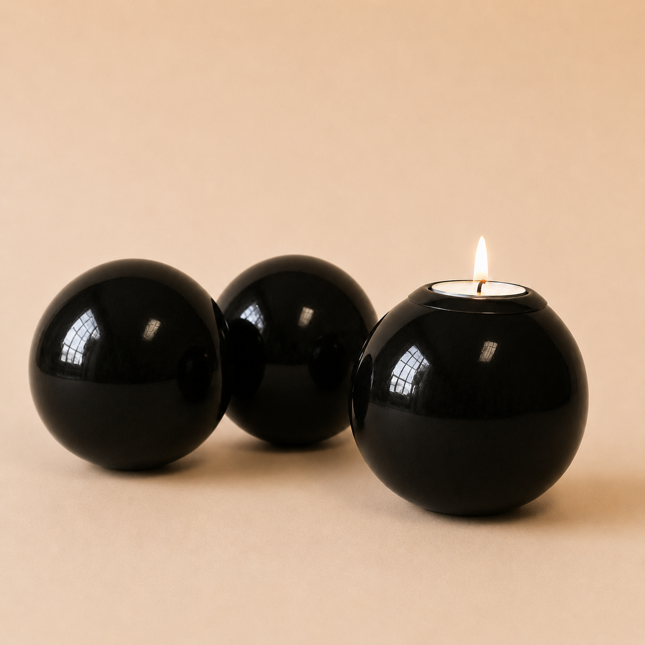 Coloured Monkey Ball & Tlite in Black on a beige background