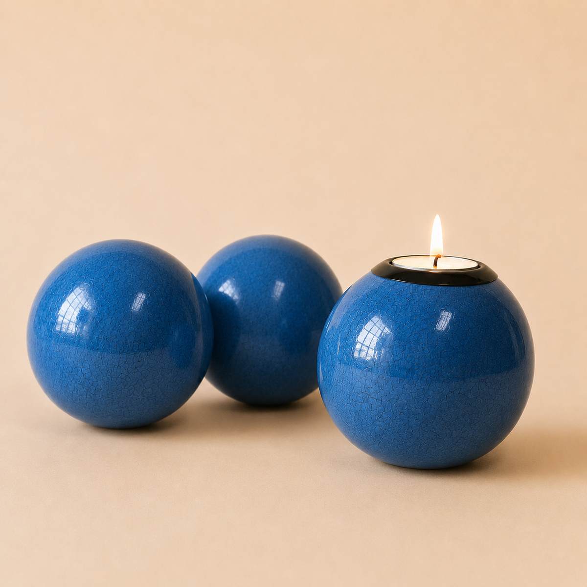 Coloured Monkey  Ball and Tlite in a blue colour on a beige background