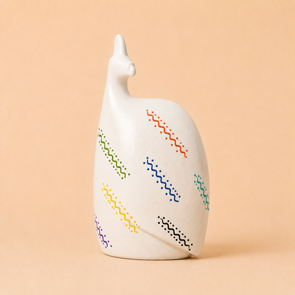 Hand painted Ethnic Guinea-fowl carving in white on a beige background