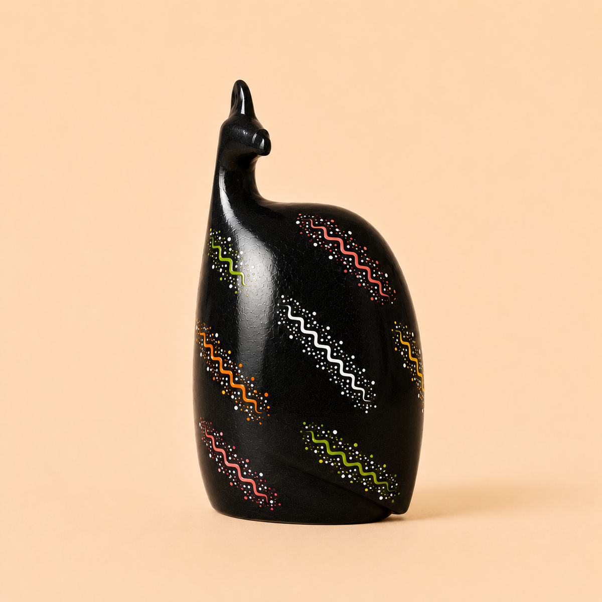 Hand painted Ethnic Guinea-fowl carving in black on a beige background