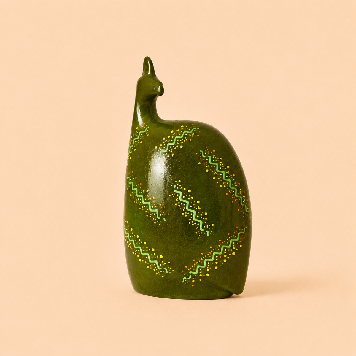 Hand painted Ethnic Guinea-fowl carving in lime with a beige background