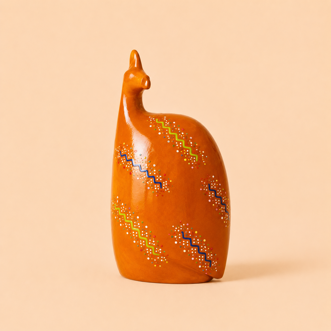 Hand painted Ethnic Guinea-fowl carving in orange on a beige background