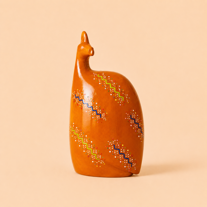 Hand painted Ethnic Guinea-fowl carving in orange on a beige background