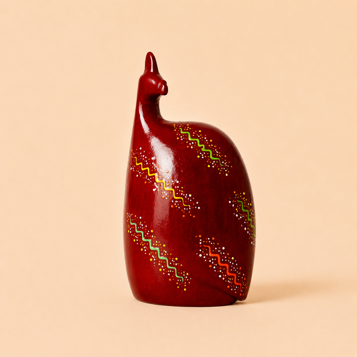 Hand painted Ethnic Guinea-fowl carving in red with a beige background