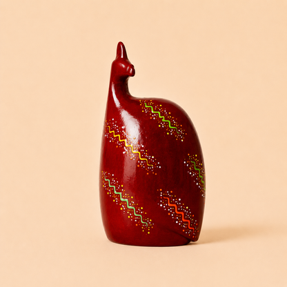 Hand painted Ethnic Guinea-fowl carving in red with a beige background