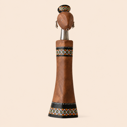 Hand painted Rainbow Doll Brown carved from wood on a beige background