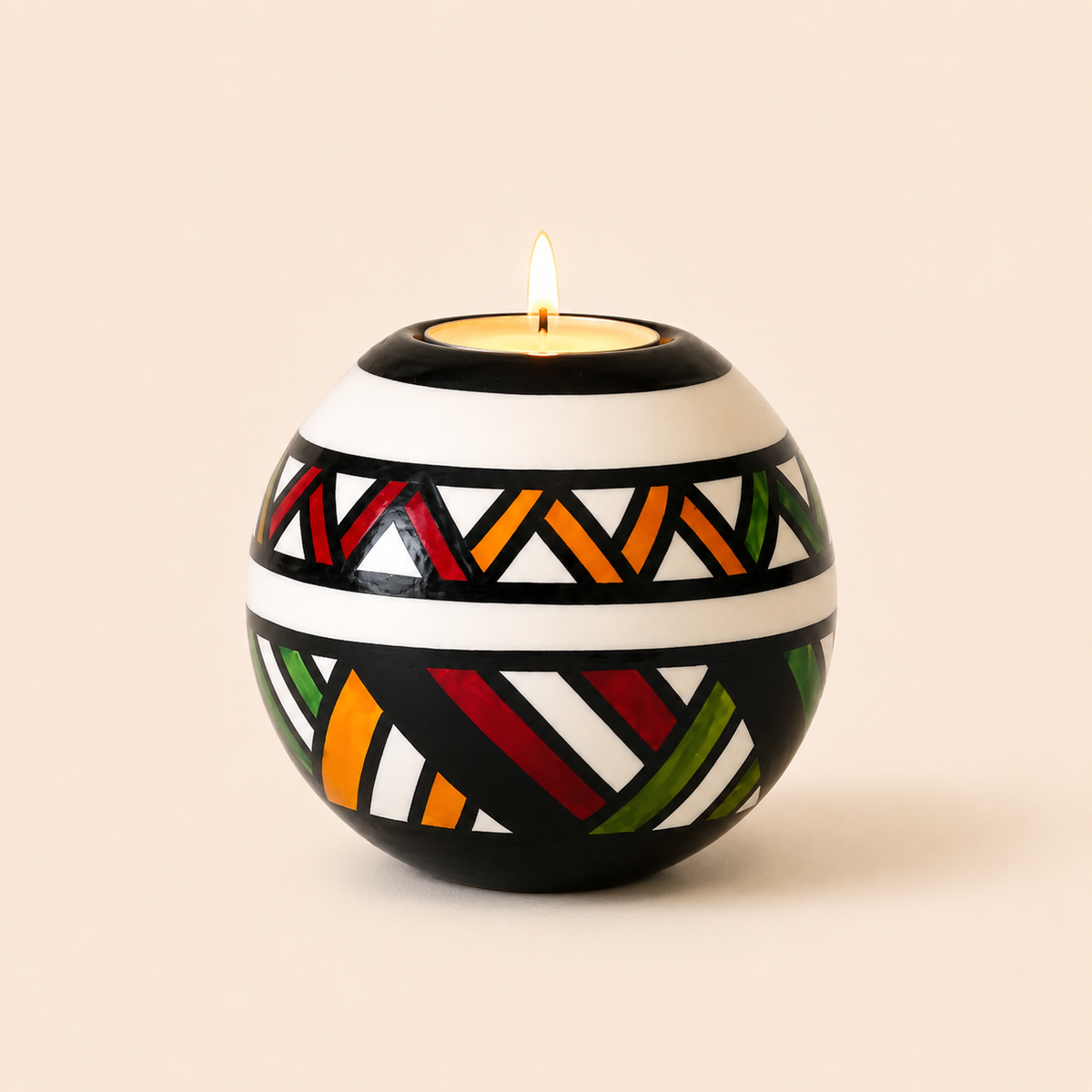 Monkey Ball T-lite with Multicolour Ndebele patterns on a beige background