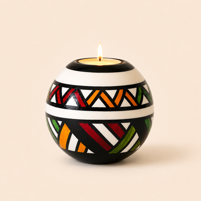 Monkey Ball T-lite with Multicolour Ndebele patterns on a beige background