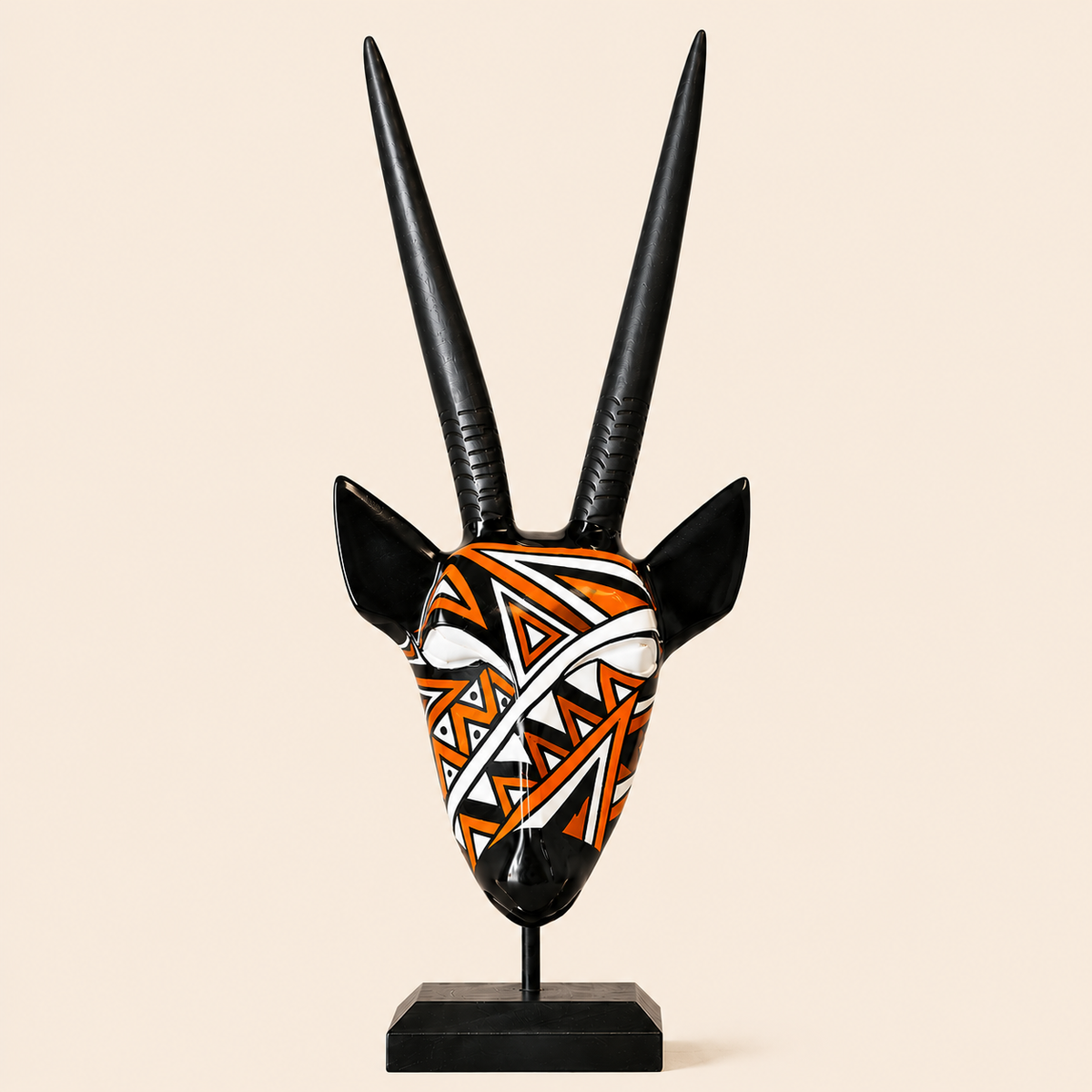 Ndebele Mono Antelope Head with orange design on a beige background