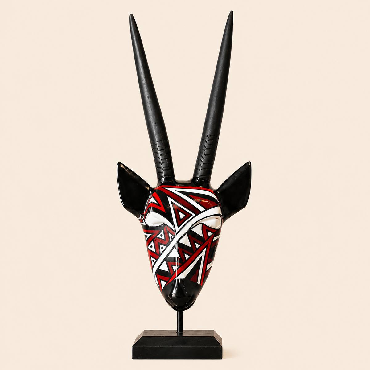 Ndebele Mono Antelope Head in a red colour on a beige background