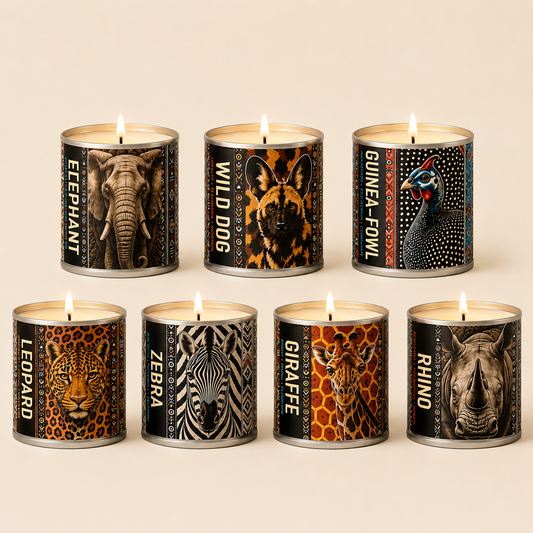 Seven textured Wildlife Candles with Elephant, Wilddog, Zebra, Leopard, Giraffe and Rhino on a beige background.