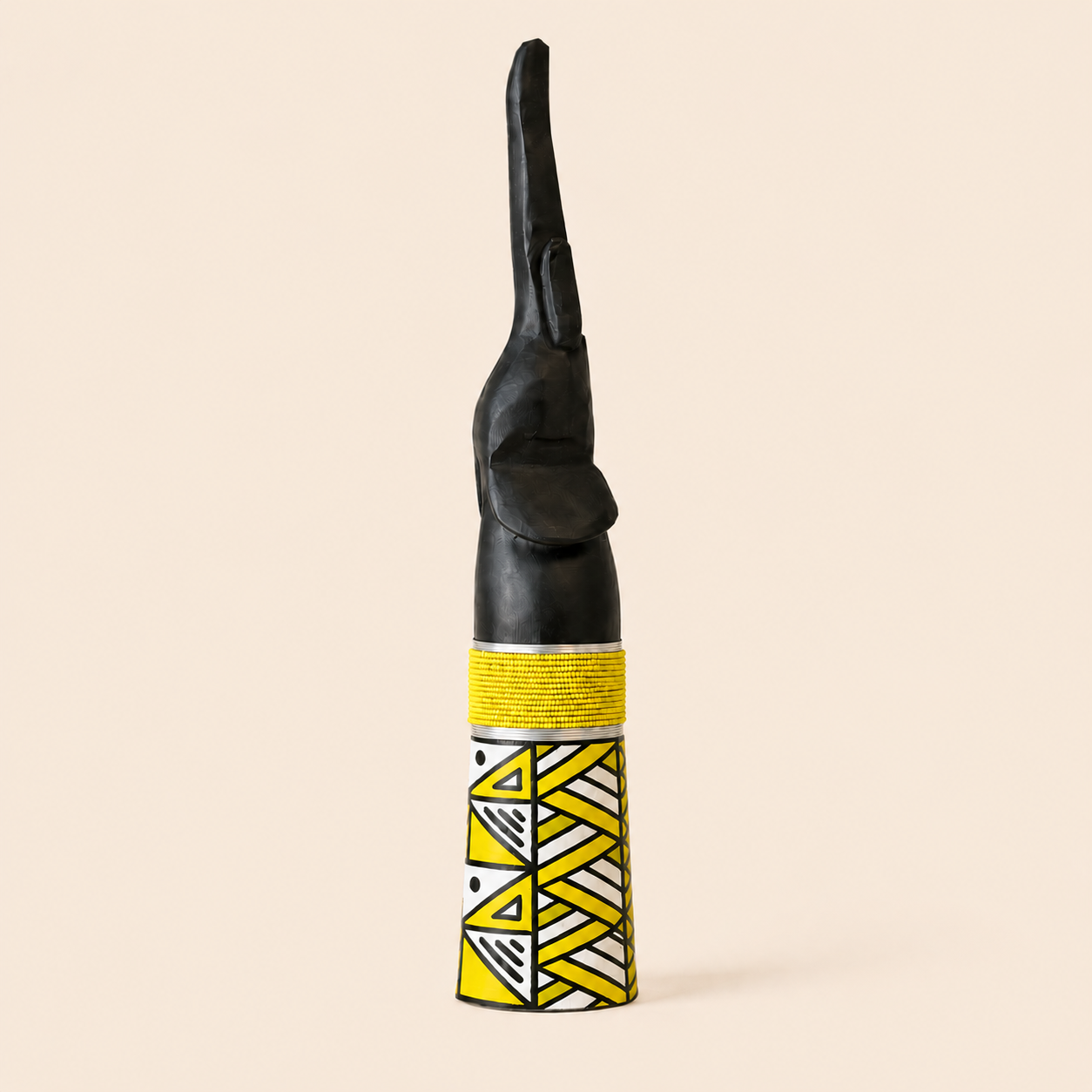 Wood carved Goodluck elephant with yellow beads and yellow ndebele patterns on the base.