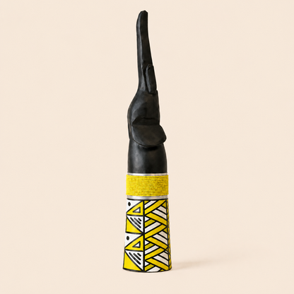 Wood carved Goodluck elephant with yellow beads and yellow ndebele patterns on the base.