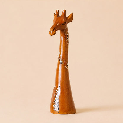 Wooden giraffe figurine on a beige background with ethnic patterns